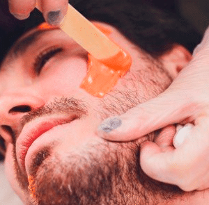 إزالة شعر الوجه ب الشمع